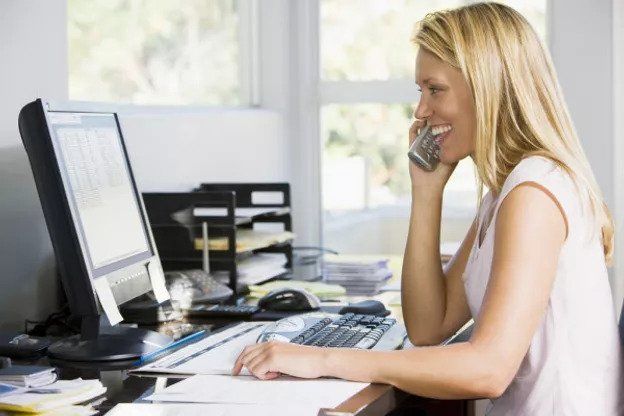 woman working on her computer in home office v3